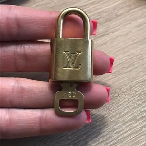 Authentic Louis Vuitton key and pad lock